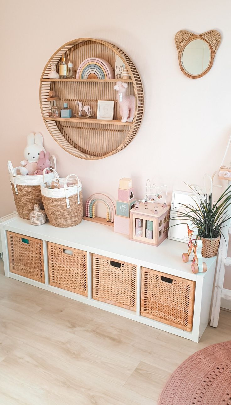 there are baskets and toys on the shelf in this room, along with other items