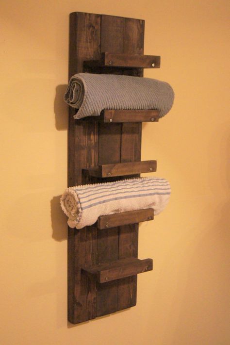 a towel rack made out of wooden pallets