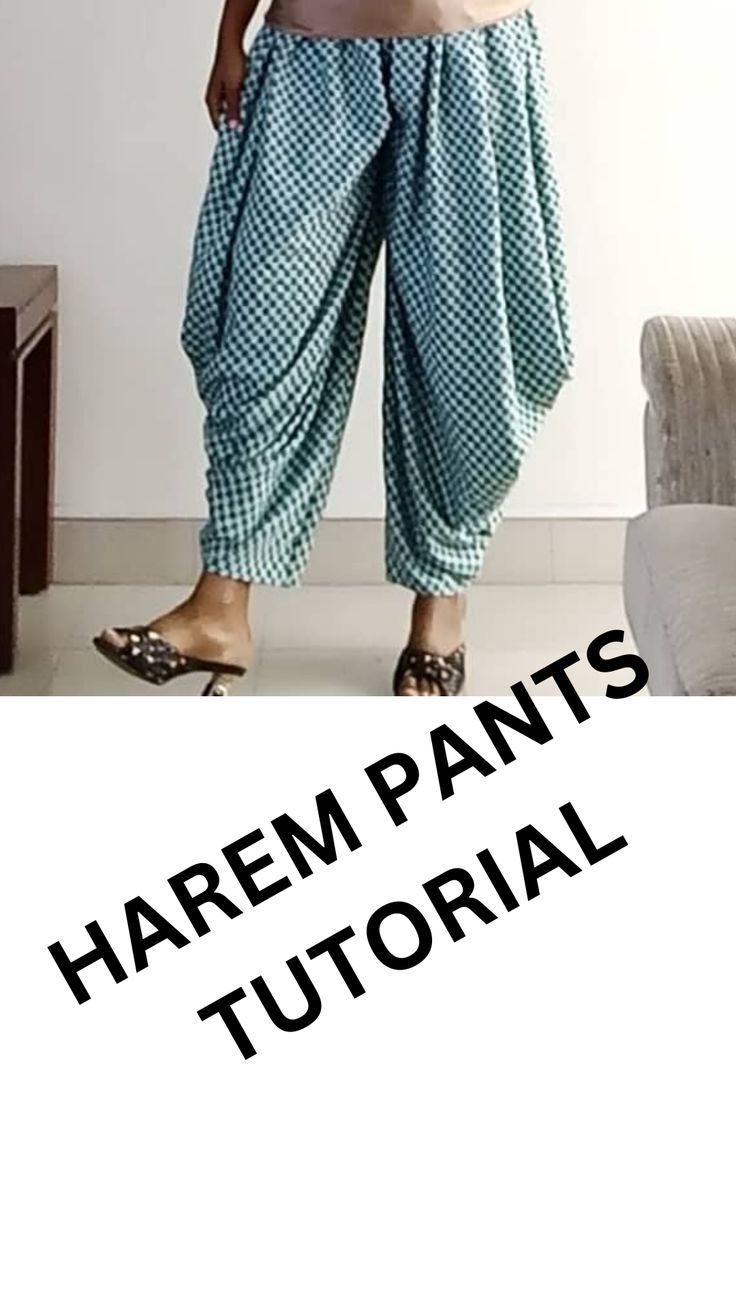 a woman standing in front of a white wall with the words harem pants on it