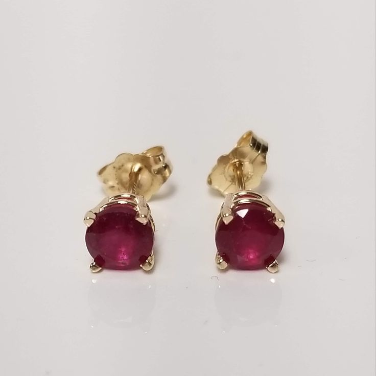 "Thanks for shopping our vintage estate store. We tend to sell well below wholesale and truly hope you enjoy all of our items. Many of the items are one of a kind, so please enjoy scrolling through the pictures and hopefully something will catch your eye. Brown spots are from camera or reflections. Nice estate 14k yellow gold natural ruby studs. Color is red testing natural and are stunning. Retails $989 on sale $289 Size: 5mm 1/4\" Weight: 1.04 grams Carat: .50ct per stud Nice studs, some that you will love, marked 14k and backs are included." Anniversary Ruby Earrings With Prong Setting, Classic Birthstone Earrings For Formal Occasions, Anniversary Ruby Earrings With Brilliant Cut, Ruby Earrings With Brilliant Cut For Anniversary, Vintage Diamond Cut Earrings As Gift, Formal Round Diamond Earrings With Birthstone, Classic Ruby Birthstone Earrings, Classic Ruby Earrings For Formal Occasions, Ruby Earrings With Prong Setting For Anniversary