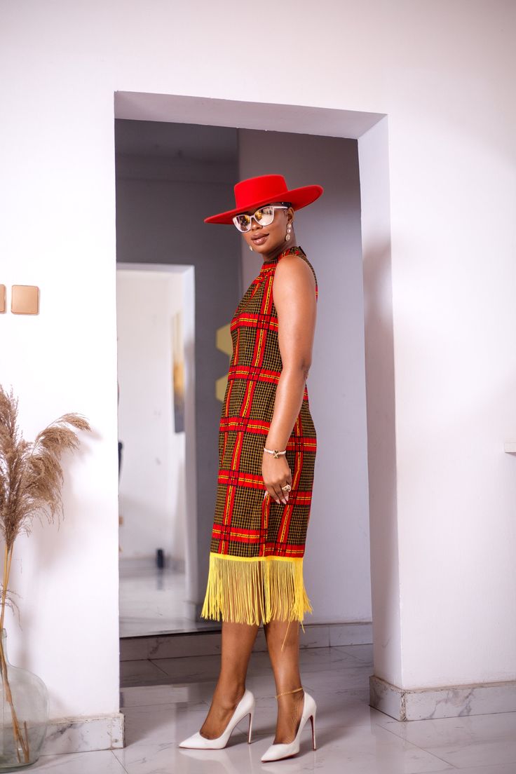 PRODUCT DETAILS: Designed in the U.S., hand-crafted in Africa Delivery within 2 weeks Print shown in Yellow, Red and Black. A relaxed fit mini dress with fringe on bottom, designed with a traditional African Ankara fabric of multicolor pattern, that gives you a style and look made for setting the trends! Can be worn for multiple formal occasions such as a dinner party or dinning or just to hang with friends out for brunch or a party! FABRIC CARE: Dry Clean. Hand Wash. SIZE CHART: Multicolor Sleeveless Fringe Dresses, Brown Sleeveless Fringe Dress, Sleeveless Brown Fringe Dress, Sleeveless Brown Dress With Fringe, Sleeveless Red Dress With Fringe, Traditional Multicolor Dresses With Tassels, Traditional Multicolor Tassel Dress, Dress With Fringe, Hanging With Friends