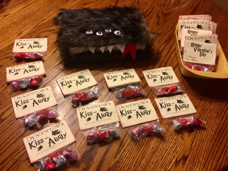 a table topped with lots of candy covered in fake teeth and fangs on top of it