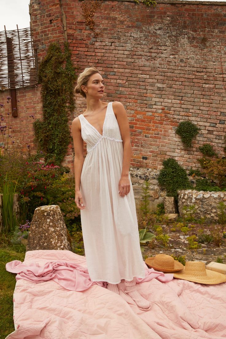 A family business, If Only If is obsessed with the classic nightgown from its timeless silhouette to the most special details. Crafted in 100% natural materials, these nightdresses are romantic, practical, and become even softer with every wash. Lace edging to the bodice creates a loose fitting silhouette and a feminine shape in the Anna Cotton V-Neck Nightdress, which is crafted in the brand's signature fine cotton voile. Product Details 100% GOTS certified organic cotton. Care Instructions Mac Elegant V-neck Nightgown For Loungewear, Elegant V-neck Sleepwear For Relaxation, Feminine V-neck Sleepwear For Lounging, Chic V-neck Sleepwear For Wedding Night, Elegant Summer Nightgown For Sleep, Elegant Summer Sleepwear For Loungewear, Elegant Summer Loungewear Sleepwear, Summer V-neck Sleepwear For Wedding Night, Feminine V-neck Lounging Sleepwear