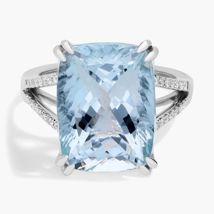 Elegant aquamarine makes a bold statement in this fashion-forward cocktail ring crafted in 14k white gold. Formal Light Blue Aquamarine Diamond Ring, Formal Light Blue Topaz Ring, Formal Light Blue Rings With Accent Stones, Formal White Gold Aquamarine Ring, Elegant Light Blue Rings For Formal Occasions, Light Blue Topaz Ring For Formal Occasions, Formal Light Blue Topaz Ring Fine Jewelry, Modern Light Blue Jewelry For Formal Occasions, Diamond Cocktail Ring