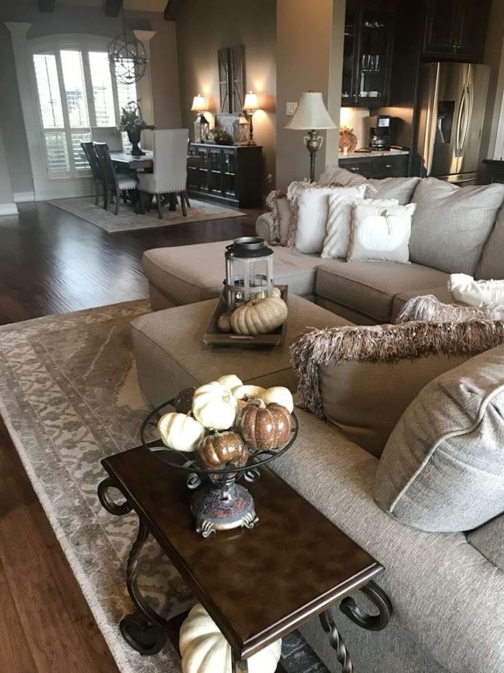 a living room filled with furniture and lots of pillows