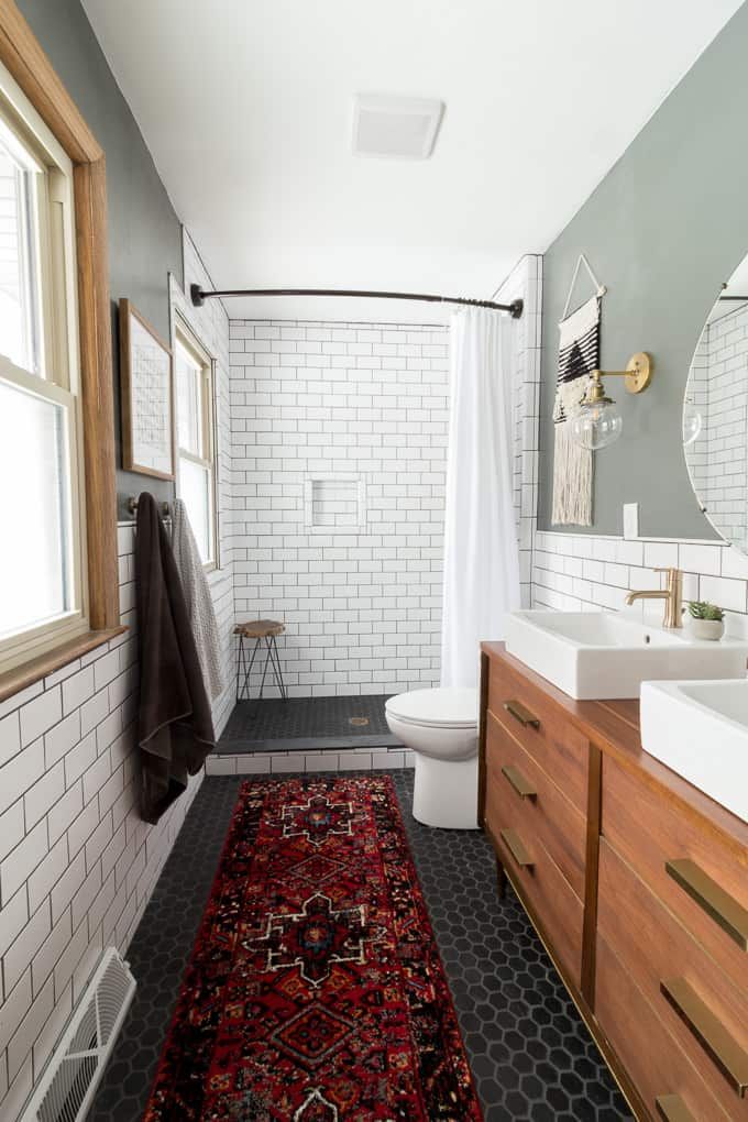 a bathroom that has a rug on the floor