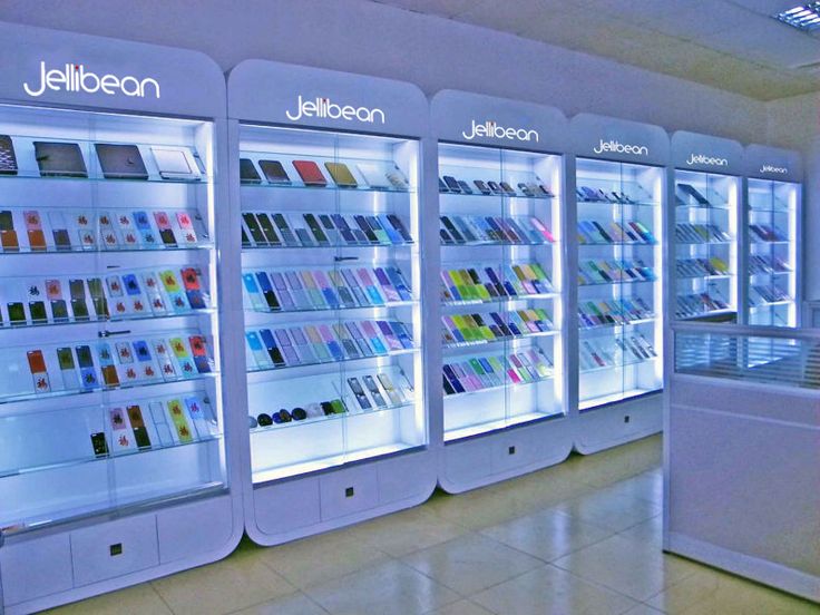 the interior of a cosmetics store with all kinds of products on display in glass cases