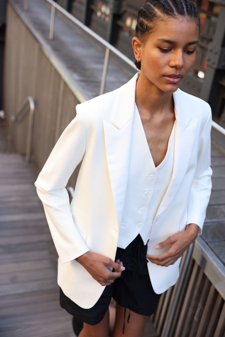 Your most versatile statement piece. Slightly oversized bright white tuxedo style blazer with white satin detailing for a subtle dressy touch. One-button front closure. Produced in NYC in Japanese-sourced fabric. SA’s Softly Suited collection: Menswear inspired suiting in feminine silhouettes and breathable, wearable f Elegant Outerwear With Suit Collar For Semi-formal Occasions, Elegant Three-piece Suit With Lapel Collar For Winter, Elegant Winter Three-piece Suit With Suit Collar, Elegant Winter Three-piece Suit, Elegant Tailored Three-piece Winter Suit, Elegant Tailored Winter Tuxedo, Elegant Tailored Tuxedo For Winter, Chic Notch Lapel Blazer For Semi-formal Events, Elegant Semi-formal Winter Tuxedo