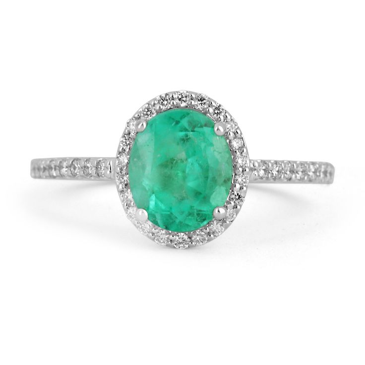 This is an exquisite, Colombian emerald and diamond halo ring. The gorgeous setting lets sit an excellent quality Colombian emerald with beautiful color and very good eye clarity. The emerald is not perfect and small imperfections do exist as it is a natural gemstone. Near colorless diamonds halo around the emerald and down the shank! This ring is incredibly comfortable to wear and would be an ideal engagement ring! Setting Style: Prong/Pave/Halo Setting Material: 14K White Gold Setting Weight: Gia Certified Oval Emerald And Diamond Ring, Oval Emerald Ring With Halo Design, Oval Green Diamond Halo Ring, Green Oval Diamond Halo Ring, Oval Emerald Ring With Halo Setting For Formal Occasions, Oval Halo Emerald Ring For May Birthstone, Classic Oval Emerald Halo Ring, Classic Oval Green Halo Ring, Gia Certified Oval Emerald Ring For Wedding