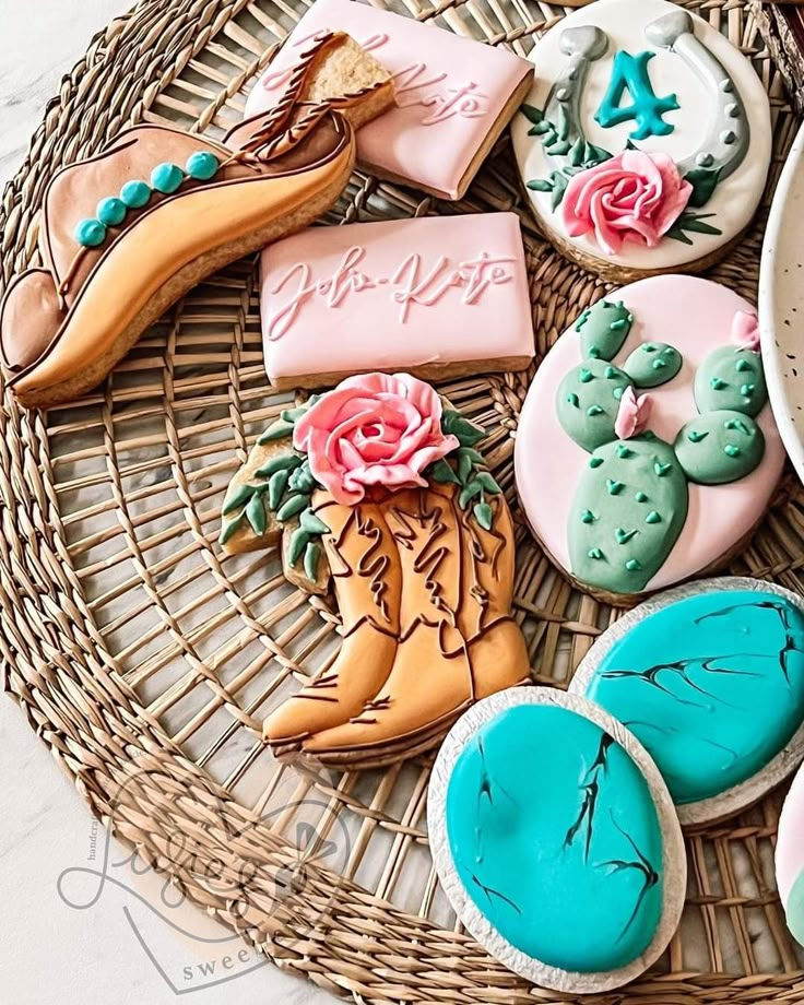 some decorated cookies are on a wicker tray