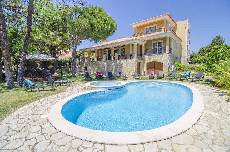 a house with a swimming pool in front of it