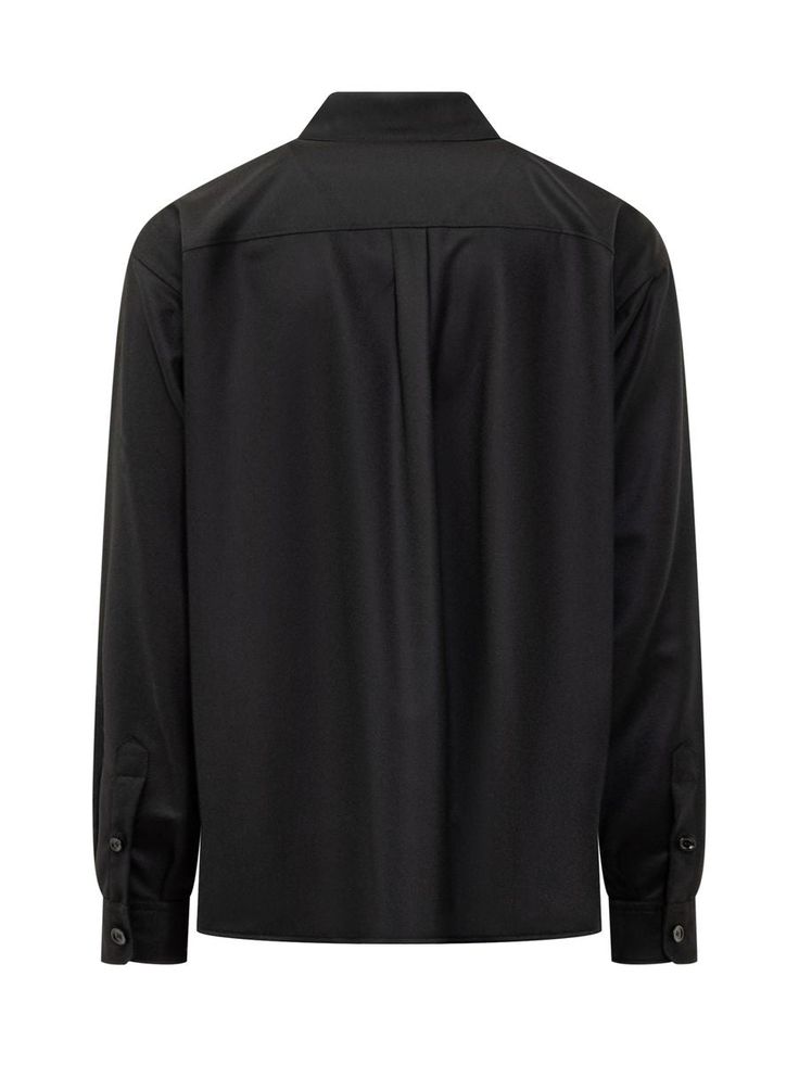 Dolce & Gabbana’s black virgin wool tailored shirt featuring a pointed collar, buttoning at the front and cuffs, buttoned flap chest pockets, logo label on the left pocket and straight hem.Gender: MENMaterial: WOOL OR FINE ANIMAL HAIR->VIRGIN WOOL100 %Color: BlackMade in: ITProduct ID: G5MD1TFU21QN0000*Import tax/duty will be calculated at checkout (If applicable) Long Sleeve Wool Shirt For Work, Collared Wool Tops For Business, Wool Long Sleeve Shirt For Work, Fall Dress Shirt With Button Closure For Work, Long Sleeve Wool Tops For Business, Lapel Collar Dress Shirt With Button Closure For Work, Lapel Collar Dress Shirt With Button Cuffs For Work, Workwear Dress Shirt With Lapel Collar And Button Cuffs, Classic Wool Shirt With Button Closure