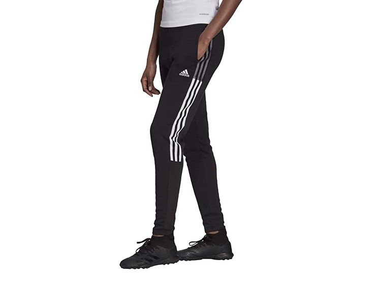 adidas Tiro 21 Sweatpants - Women's Casual Pants : Black : The primary materials that compose this product contain a minimum of 20 percent recycled content. Everyone needs a good pair of sweatpants like the adidas Tiro 21 Sweatpants. Regular tapered fit. Drawstring elasticized waist. Ribbed lower legs with zipped ankles. Moisture absorbing fabric wicks sweat away. 100% recycled polyester. Machine wash warm, tumble dry low. Imported. Measurements: Waist Measurement: 32 in Outseam: 39 in Inseam: 3 Relaxed Fit Sportswear Activewear With Three Stripes, Relaxed Fit Sportswear Bottoms With Three Stripes, Adidas Relaxed Fit Athleisure Joggers, Branded Relaxed Fit Sportswear Joggers, Three Stripes Relaxed Fit Activewear For Workout, Sporty Relaxed Fit Sweatpants With Three Stripes, Relaxed Fit Activewear For Workout, Adidas Relaxed Fit Jogging Bottoms, Athleisure Jogging Bottoms With Three Stripes Branding