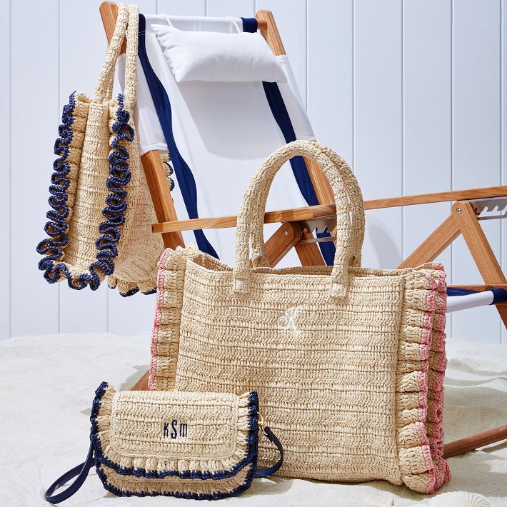 A beach-ready oversized tote, crafted from unlined twisted raffia, is a must-have on sunny days. The structured, durable handle, tassel accessory and playful handcrafted ruffled edging make it stand out, at the shore, by the pool or anywhere you need ample storage for long summer days. A monogram adds a personal touch.  17"w x 4"d x 13"h  Handle drop: 8"  Paper straw and twisted raffia.  Spot clean and store only when completely dry.  Made in India.  Monogramming is embroidered. Rose Shadow, Summer Luxury, Oversized Tote, Beach Ready, Paper Straws, Saved Items, School Days, Crossbody Strap, Summer Days