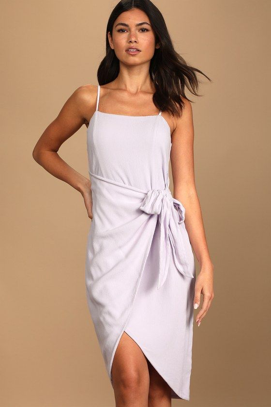 Sweltering days call for chilled wine and the Lulus Stay Sunny Lavender Faux Wrap Midi Dress! Lightweight, linen-like woven fabric shapes this perfect summer dress that boasts a straight neckline, adjustable spaghetti straps, and a relaxed silhouette that'll keep you cool when the temps really start to rise! Overlapped skirt panel ties at the side to form a faux-wrap effect above the tulip midi hem. Hidden back zipper/clasp. Fit: This garment fits true to size. Length: Knee to mid-calf length. S Purple Chic Mini Dress With Square Neck, Chic Purple Square Neck Mini Dress, Chic Purple Mini Dress With Square Neck, Chic Purple Dress With Square Neck, Purple Midi Dress For Summer Day Out, Elegant Summer Mauve Midi Dress, Elegant Mauve Midi Dress For Summer, Summer Day Out Purple Midi Dress, Summer Dress With Straight Neckline In Purple