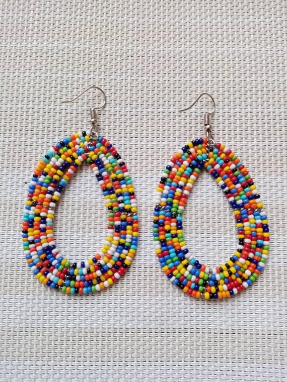 Circle Earrings | Custom Earrings | Hoop Earrings | Dainty Earrings | Beaded Earrings | Moms Gift | Gift Ideas | Unique Gift These eye catching  earrings are superbly crafted and can be worn with any outfit.The earrings are very light to wear.Main Color - multi color.The earrings measure 3 inches from top of the hook.**Buy multiple items and pay shipping for 1 item only.The rest ships free.Feel free to send me a convo or e-mail for any clarification or wholesale pieces.Thank you for visiting... Cheap Multicolor Beaded Earrings For Gifts, Traditional Small Hoop Multicolor Earrings, Traditional Multicolor Small Hoop Earrings, Multicolor Handmade Beaded Earrings, Handmade Multicolor Round Beads Earrings, Unique Multicolor Small Hoop Earrings, Handmade Multicolor Small Hoop Jewelry, Multicolor Teardrop Hoop Earrings, Multicolor Teardrop Jewelry For Crafting