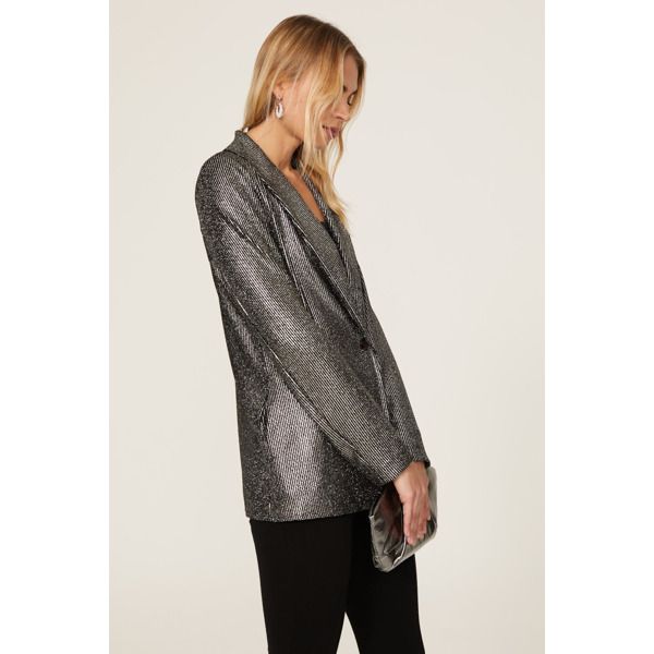 Silver nylon (60% Nylon, 40% Metallic). Blazer. Long sleeves. Front button closure. 27.5" from shoulder to hemline. Made in the Usa. Metallic Long Sleeve Blazer For Night Out, Metallic Long Sleeve Winter Blazer, Winter Metallic Long Sleeve Blazer, Winter Long Sleeve Metallic Blazer, Metallic Long Sleeve Blazer For Fall, Chic Metallic Long Sleeve Blazer, Chic Long Sleeve Metallic Blazer, Chic Button-up Party Blazer, Chic Button-up Blazer For Party