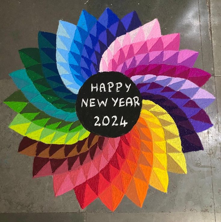 a happy new year sign painted on the ground with colorful colors and black lettering that reads, happy new year 2012