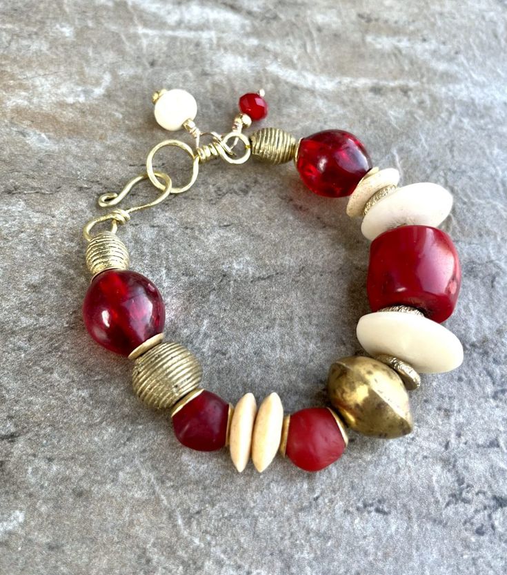 Boho Chic Bracelet Red Coral, African Tribal Brass, Red Resin Beads Bohemian Bangle With Polished Beads, Elegant Red Hand-strung Beaded Bracelets, Traditional Hand Wrapped Red Bracelets, Traditional Red Hand Wrapped Bracelets, Unique Red Bangle Jewelry, Traditional Red Hand-wrapped Bracelet, Spiritual Large Red Beads, Hand-strung Red Coral Beaded Bracelets With Round Beads, Bohemian Beaded Bracelets With Large Beads For Festive Occasions