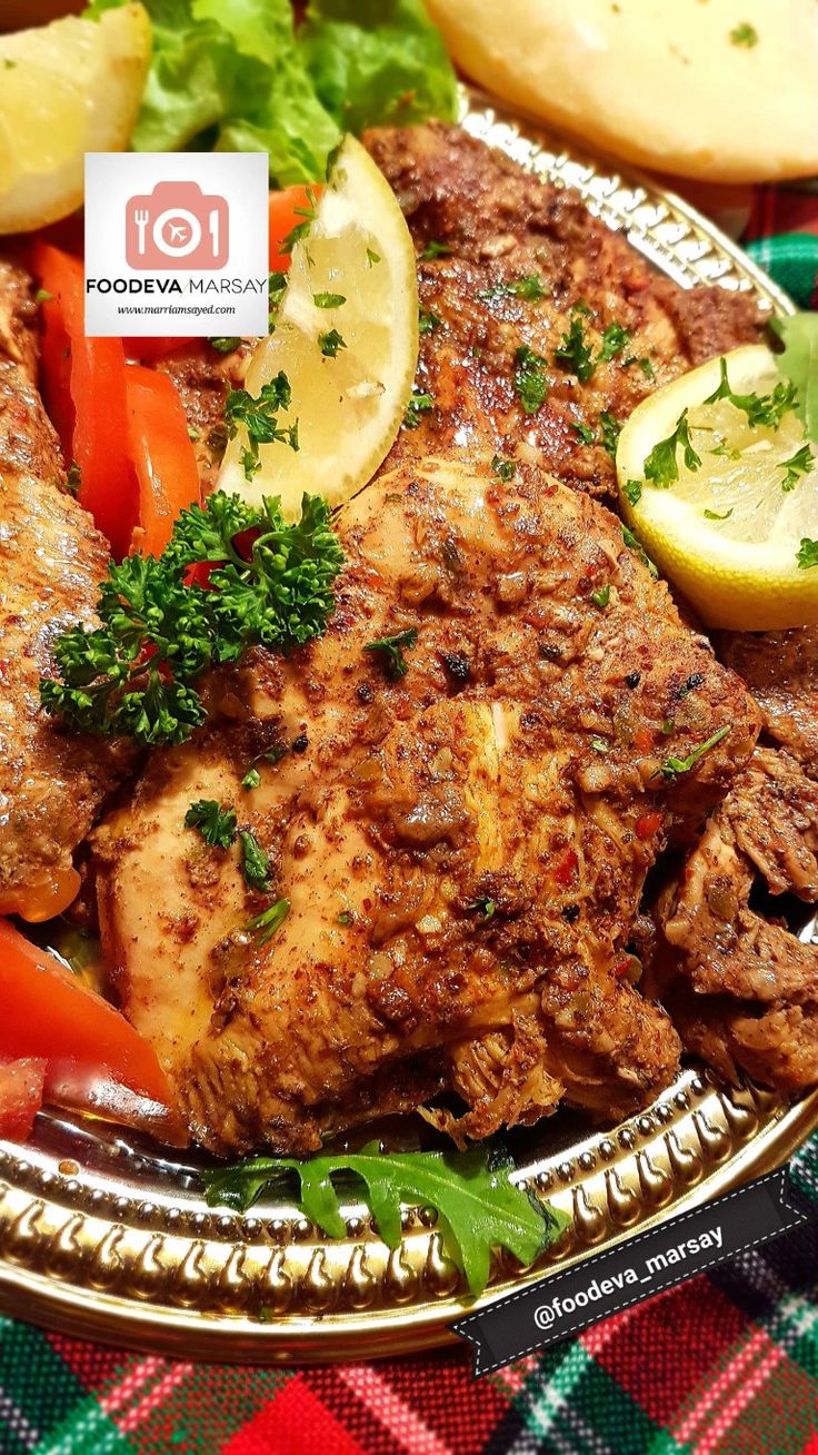 a plate full of meat and vegetables on a table