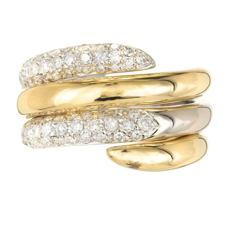 Two Tone gold Interlocking diamond swirl cocktail ring. Two rings that are on the spiral interlocking one is an 18k yellow gold high polish spiral. The second one is an 18k white gold diamond and pave set spiral on top. Rings can be worn together or separate. 79 round G-H SI-I diamonds Approximate .69 total carat weight Size 7.75 and sizable 18k yellow gold 18k white gold Tested: 18k Stamped: 18k 750 11 Grams 14.68mm wide at top 3.39mm high at top 6.62 wide at bottom 7 Carat Diamond Ring, Rose Branding, Round Diamond Eternity Band, Wedding Diamond Rings, St Clare, Coil Ring, Pendants Diamond, Bracelets Diamond, Wedding Diamond