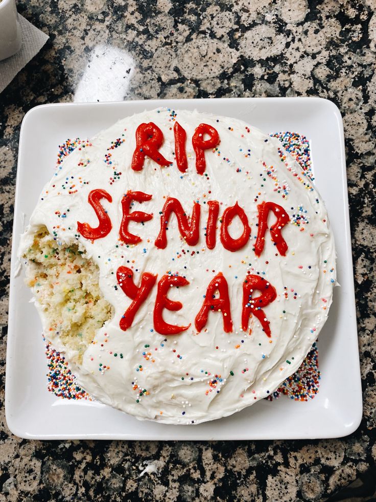 a birthday cake with the words rip senior year written on it and sprinkles