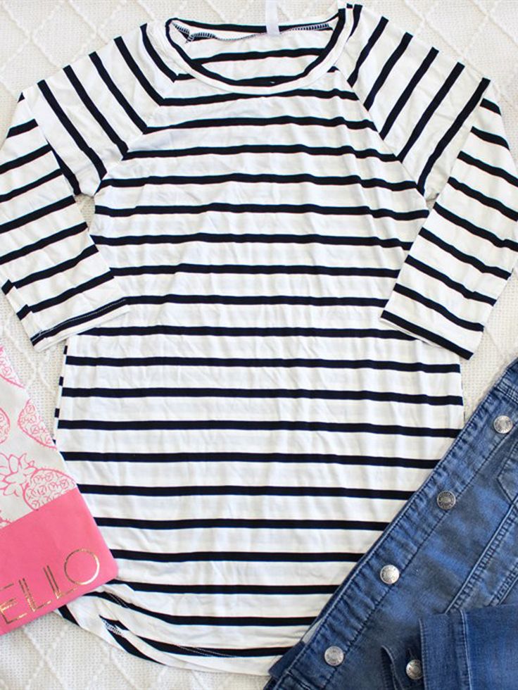 Looking for a trendy and comfortable addition to your wardrobe? Look no further than our Striped Tunic! Perfect for any occasion, this tunic features stylish stripes that are all the rage this season. Made from ultra-soft material, you'll never want to take it off! But don't just take our word for it - the Striped Tunic is a customer favorite. Available in sizes Small through XL, you can choose the perfect fit for your style. For a looser fit, we recommend sizing up. Our model is wearing a size Custom Coffee Mugs, Striped Tunic, Summer To Fall, Custom Coffee, Navy Stripes, Fall Looks, Running Errands, Camo, Going Out