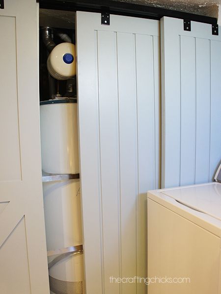 a washer and dryer sitting in a room next to an open closet door