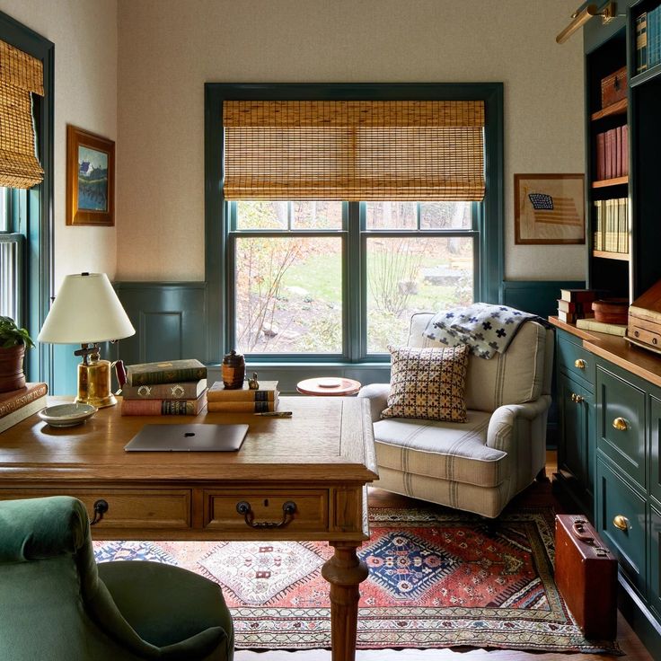 a living room filled with furniture and lots of books on top of a wooden table