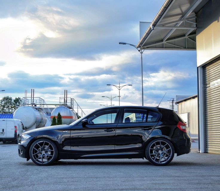 a black car parked in front of a building