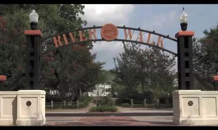 the entrance to river walk is shown in this time lapse photo from an angle