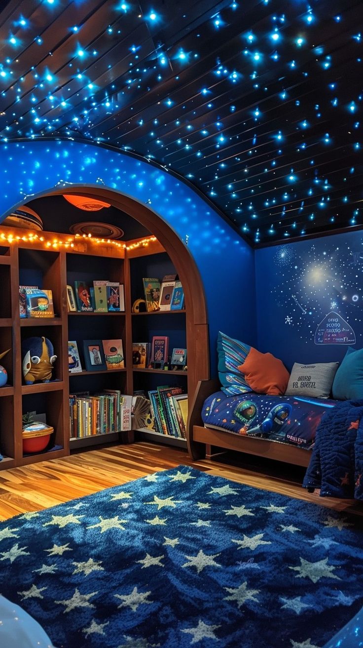 a child's bedroom decorated in blue with stars on the ceiling and bookshelves