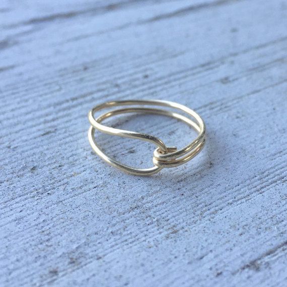 a gold ring sitting on top of a wooden table