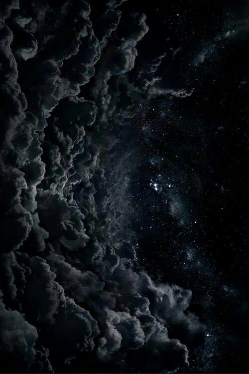 the night sky is filled with clouds and stars