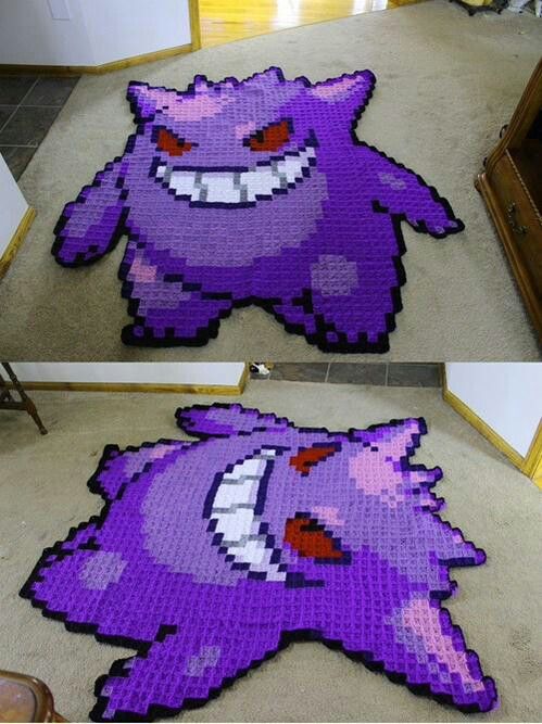 the rug is made to look like an image of a purple monster with big eyes