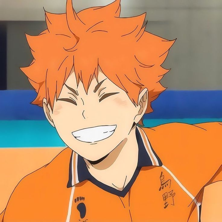 an anime character with orange hair and white teeth smiles at the camera while wearing an orange shirt