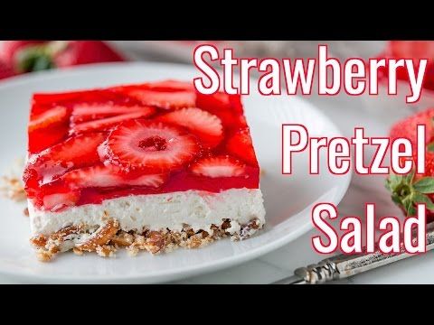 a piece of strawberry pretzel salad on a white plate