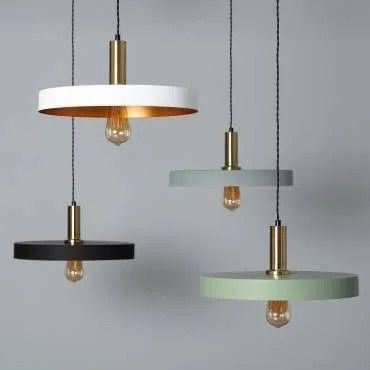 three different colored lights hanging from the ceiling