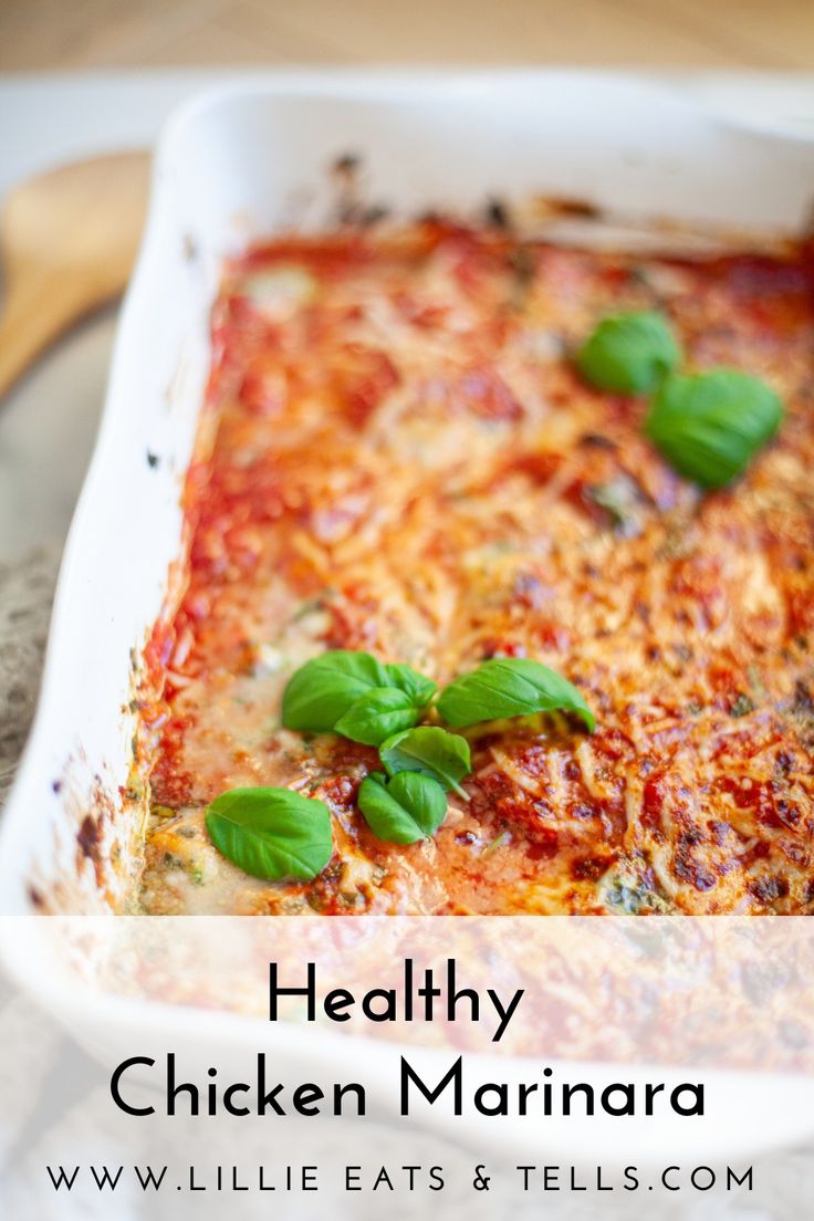 a casserole dish with chicken marinara and basil garnish on top