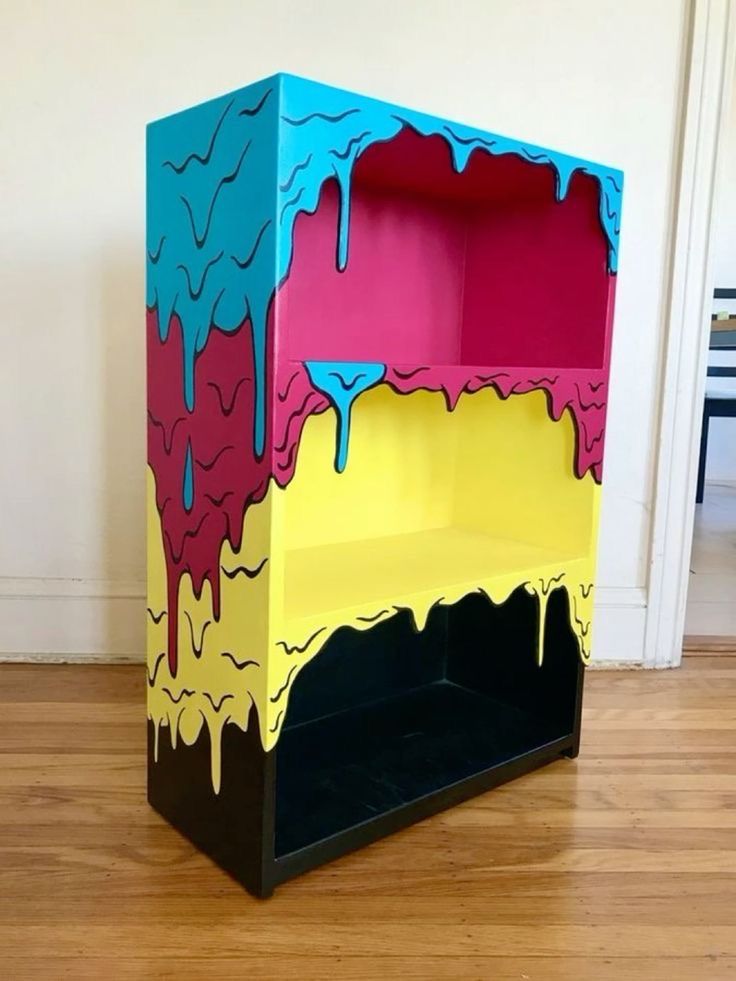 a colorful shelf sitting on top of a hard wood floor