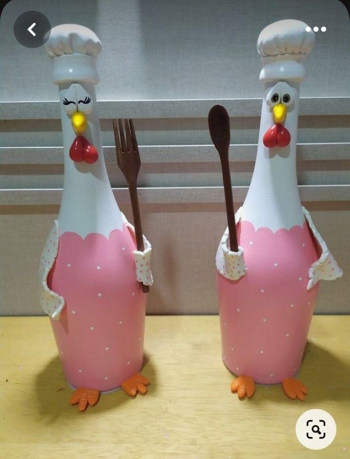 two chicken shaped utensils are sitting on a table