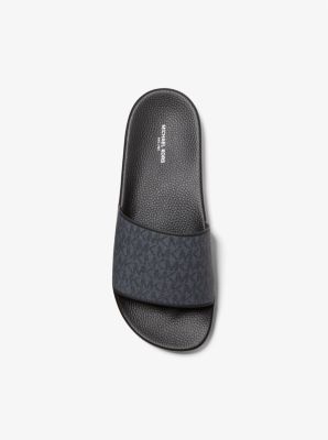 Our Jake slides are a stylish choice for both beach getaways and city breaks—the contoured footbeds ensure they’re comfortable to walk in when taking in the sights. Featuring our signature logo print these sandals will work just as well with a pair of swim shorts by the water as with denim jeans around town. Black Slides With Logo, Black Logo Slides, Logo Open Toe Sandals For Summer, Casual Open Toe Slides With Embossed Logo, Summer Slide Sandals With Logo, Black Logo Sandals For Summer, Summer Beach Slides With Logo, Logo Open Toe Slides For Beach, Modern Summer Slides With Ortholite Insole