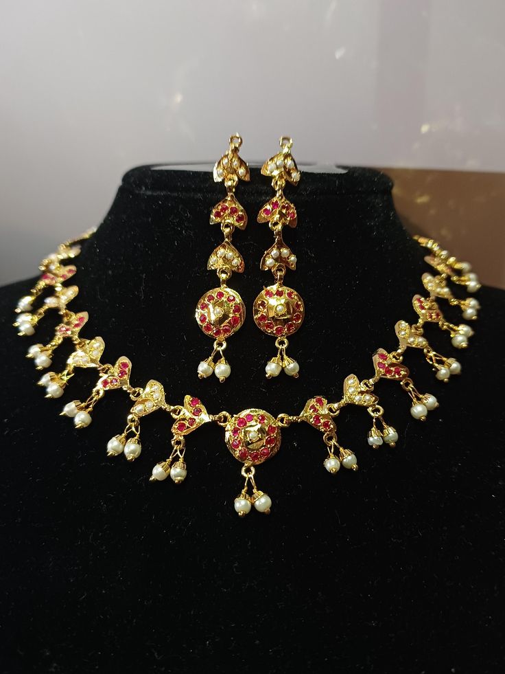 Traditional Beautiful  handcrafted Jadau  designer sets in semi precious pearls and stones  ◾24 carat gold plated  ◾ Repolishable Jewellery ◾Next to real jewellery ◾copper based jewellery 22k Gold Pearl Necklace For Celebrations And Festivals, Gold Hallmarked Kundan Necklace For Diwali, Festive Red Temple Necklace, Festive Gold-plated Temple Necklace With Stone Work, Gold Kundan Necklace For Eid, 22k Gold Kundan Necklace For Diwali, Yellow Gold Kundan Necklace For Festivals, Festival Yellow Gold Kundan Necklace, Heavy Temple Jewelry Necklaces For Eid