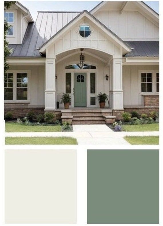 the exterior of a house with white and gray paint colors on it, including green doors