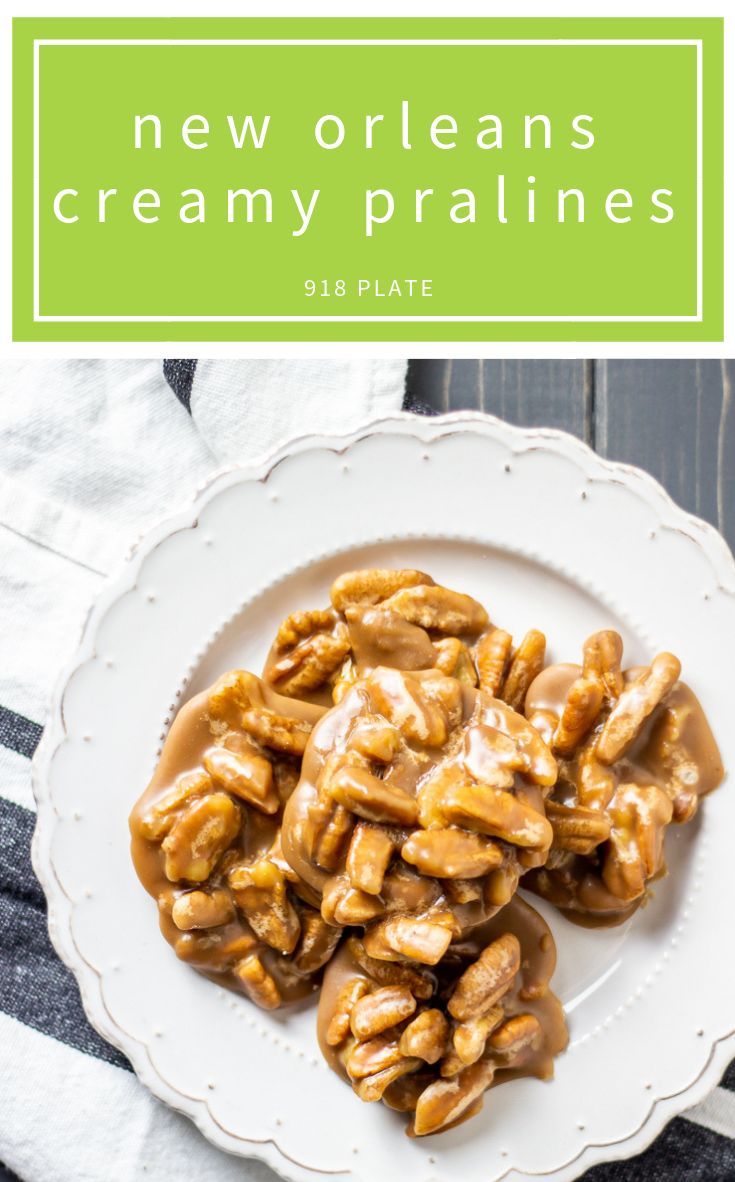 a white plate topped with peanut brittles covered in caramel sauce and drizzled