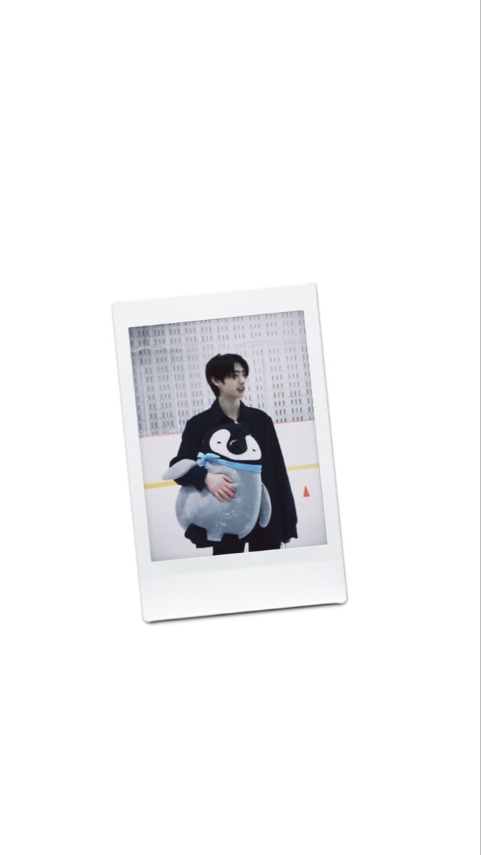 a polaroid photograph of a man holding an ice hockey pucker in his arms