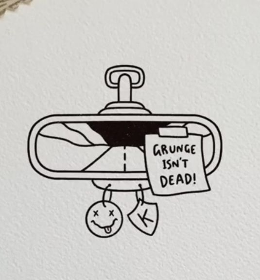 a black and white drawing of a toilet paper dispenser with the words grunge isn't dead on it