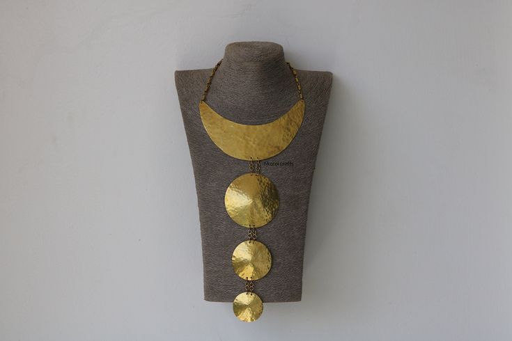 African Brass necklace, Brass jewelry, African jewelry for women, Tribal necklace, One size fits all, Christmas Gift for her, Moms gift The necklace is handcrafted using brass metal. Length: 11 inches Shipping fee is for the first item only, additional items ship for FREE. DHL Express shipping with 3-5 days delivery. To view our brass collection, click here: https://www.etsy.com/shop/NkoroiCrafts?ref=simple-shop-header-name&listing_id=1295061994&section_id=39639351 *Care instructions* Brass tarn Handmade Metal Bib Necklace In Costume Jewelry Style, Handmade Metal Bib Necklace Costume Jewelry, Metal Bib Necklace For Costume Jewelry Gift, Metal Bib Necklace As Costume Jewelry Gift, Handmade Metal Necklaces For Weddings, Metal Bib Necklace With Adjustable Chain As Gift, Brass Costume Jewelry Necklaces As Gift, Gold Vintage Bib Necklaces For Gifts, Handmade Round Metal Necklace