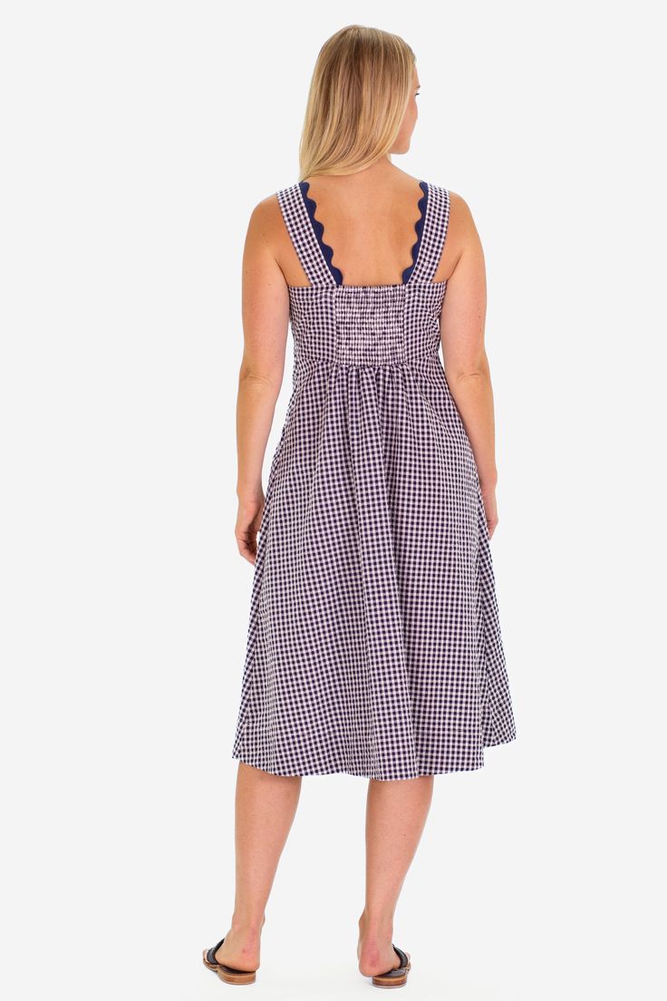 The RicRac Wendy dress is the perfect pop of spring, ready to take you to the farmers market, brunch, and a sunny shopping day FEEL: The classic Navy Gingham is a woven fabric that is breathable yet will withstand many seasons of wear. (50% polyester, 50% cotton) FAVORITE FEATURES: Scallop neckline detail Midi length Thick tank strap-bra friendly! Spring Gingham Sundress With Ruffles, Summer Gingham Cotton Midi Dress, Summer Cotton Gingham Midi Dress, Plaid Sundress Midi Dress For Summer, Picnic Gingham Sundress With Ruffles, Spring Gingham Cotton Sundress, Summer Cotton Midi Dress For Picnic, Casual Gingham Cotton Midi Dress, Cotton Midi Dress For Picnic