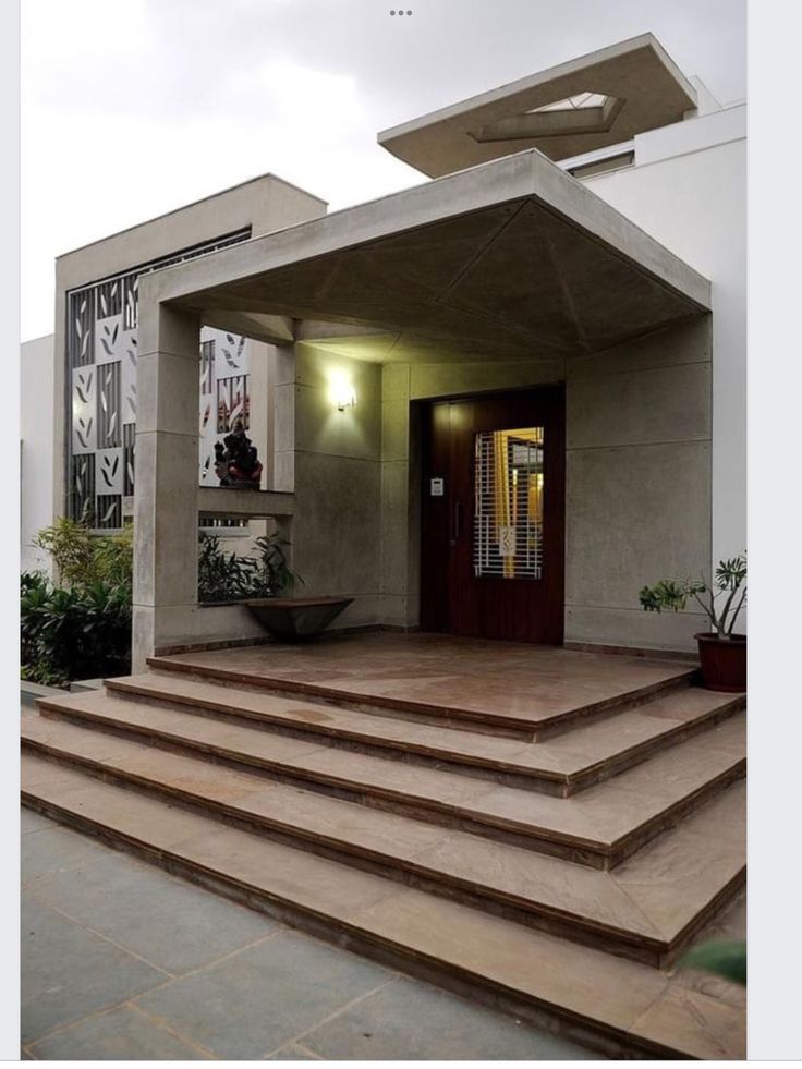 a house with steps leading up to the front door